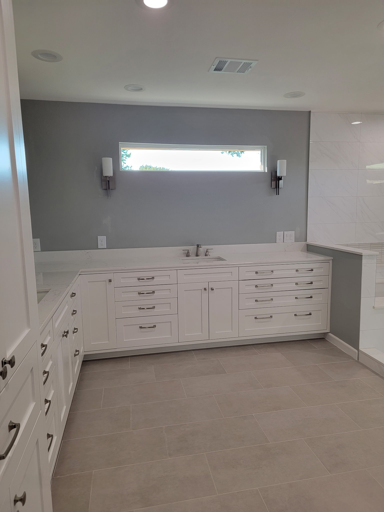 Two separate bathrooms converted into a master bathroom with a big open closet