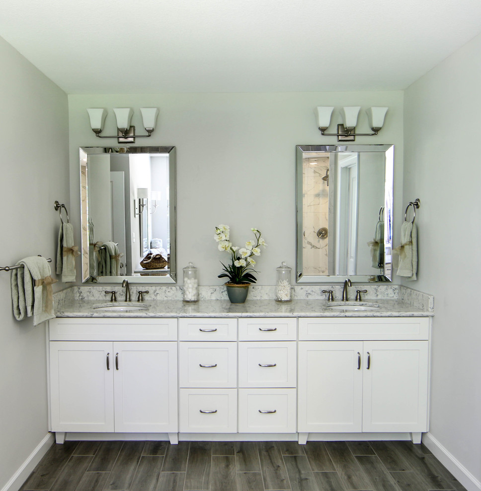 Inspiration for a large beach style master bathroom in Other with shaker cabinets, white cabinets, a corner shower, a two-piece toilet, multi-coloured tile, ceramic tile, grey walls, ceramic floors, an undermount sink and engineered quartz benchtops.