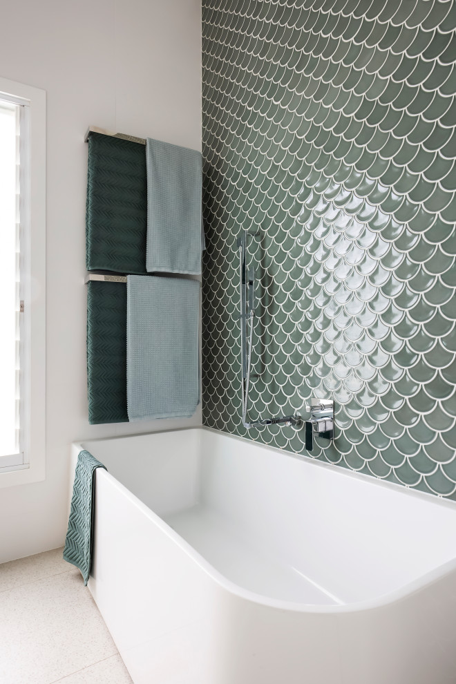 Photo of a mid-sized contemporary master bathroom in Sydney with flat-panel cabinets, medium wood cabinets, a corner tub, a corner shower, green tile, porcelain tile, white walls, porcelain floors, a console sink, engineered quartz benchtops, beige floor, a sliding shower screen, white benchtops, a single vanity, a freestanding vanity, vaulted and planked wall panelling.