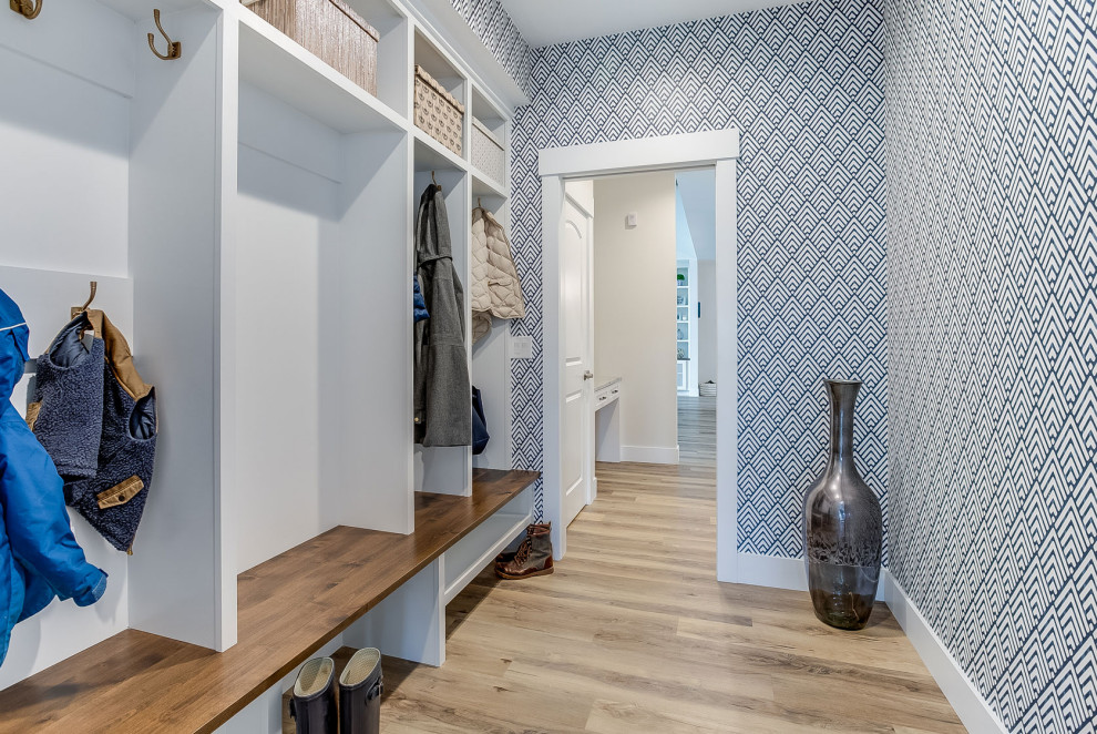 Mid-sized transitional mudroom in Other with multi-coloured walls, beige floor and wallpaper.
