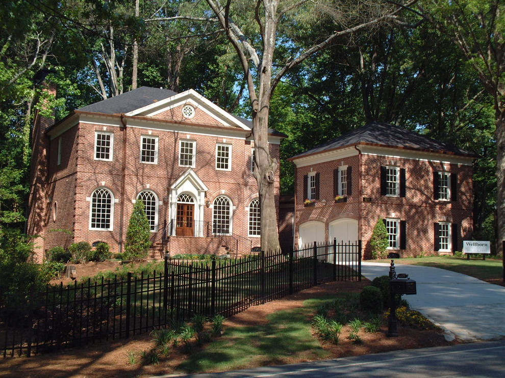 Design ideas for an expansive traditional two-storey brick red exterior in Atlanta with a gable roof.