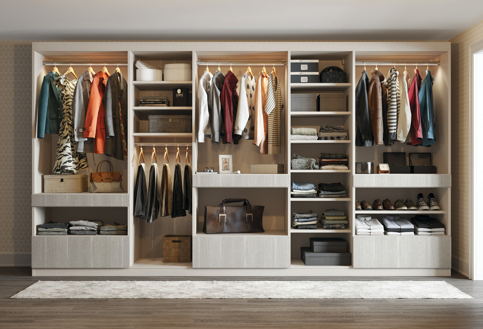 Inspiration for a mid-sized contemporary gender-neutral built-in wardrobe in Nashville with open cabinets, beige cabinets and dark hardwood floors.