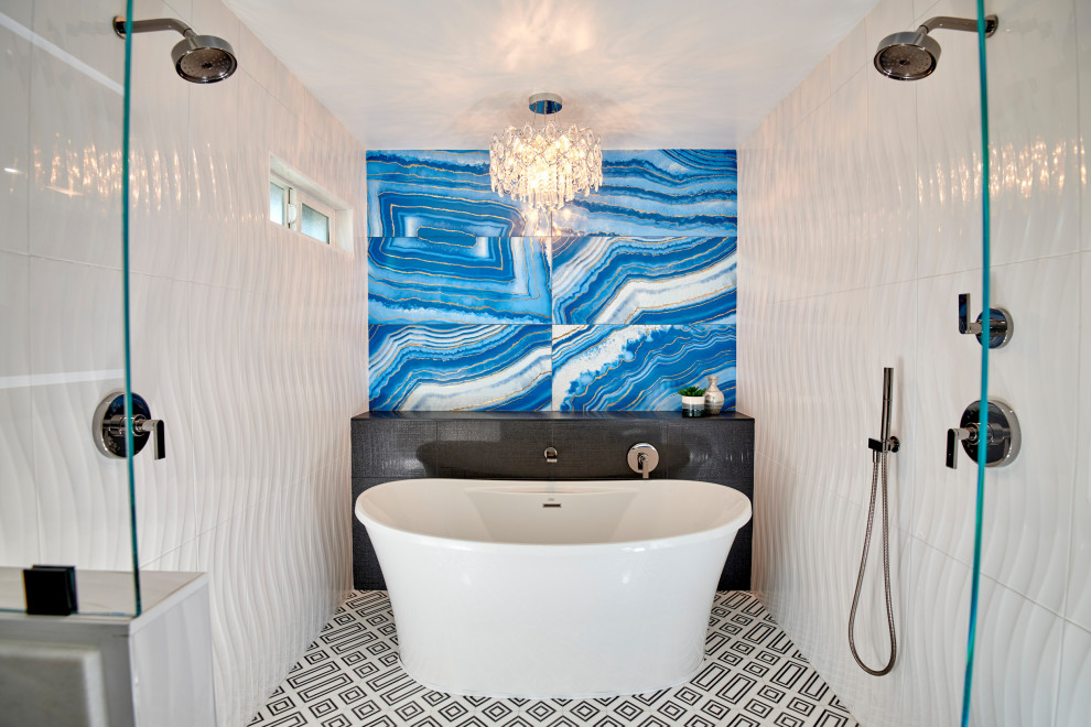 Example of a large minimalist master blue tile and porcelain tile marble floor, black floor, double-sink and wall paneling bathroom design in Denver with flat-panel cabinets, white cabinets, a one-piece toilet, white walls, an undermount sink, marble countertops, white countertops, a niche and a freestanding vanity