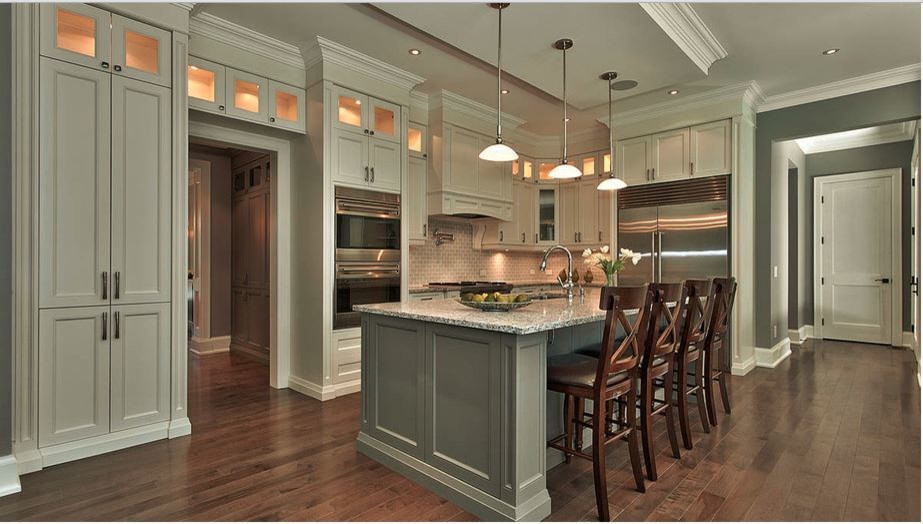 Mid-sized transitional l-shaped dark wood floor open concept kitchen photo in Toronto with a double-bowl sink, shaker cabinets, white cabinets, granite countertops, gray backsplash, subway tile backsplash, stainless steel appliances and an island