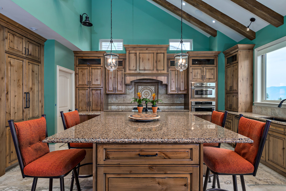 Mid-sized transitional u-shaped travertine floor kitchen pantry photo in Vancouver with an undermount sink, medium tone wood cabinets, granite countertops, brown backsplash, stone tile backsplash, paneled appliances and an island