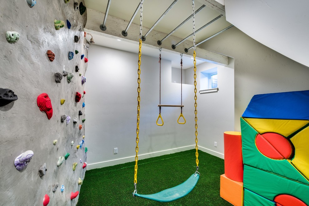 Photo of a mid-sized eclectic home climbing wall in Boise with white walls, carpet and green floor.