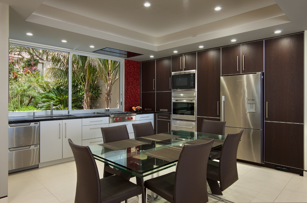 Design ideas for a large contemporary l-shaped eat-in kitchen in San Diego with an undermount sink, flat-panel cabinets, dark wood cabinets, stainless steel appliances, window splashback, porcelain floors, no island and beige floor.
