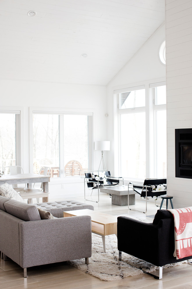 Beach style open concept living room in Minneapolis with white walls.