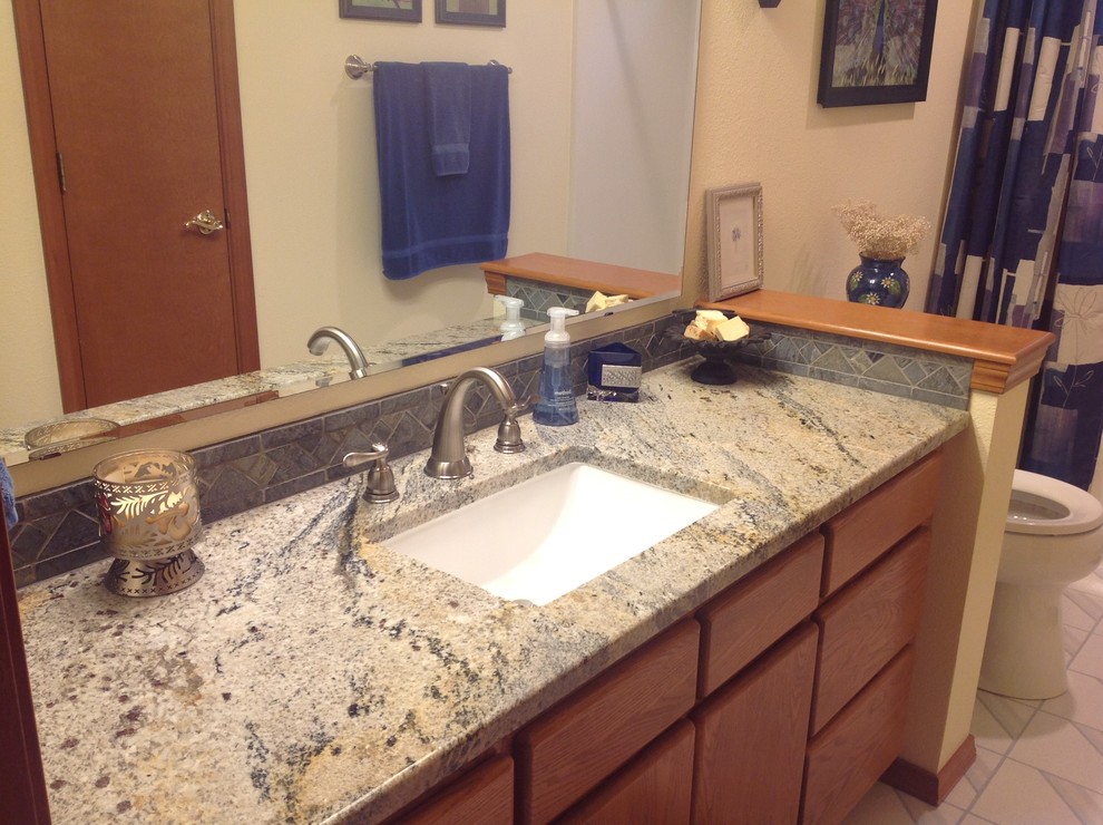 Bathroom - transitional bathroom idea in Seattle with an undermount sink and granite countertops