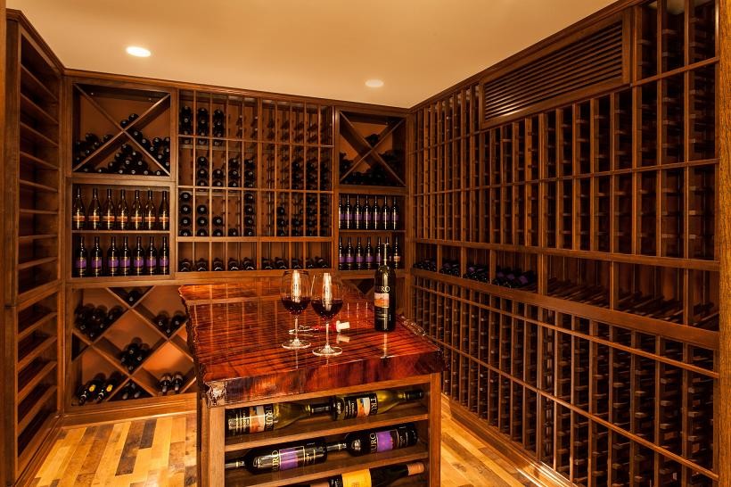 Design ideas for a large traditional wine cellar in Boston with light hardwood floors, storage racks and yellow floor.