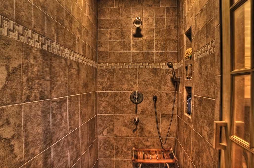 Inspiration for a transitional brown tile alcove shower remodel