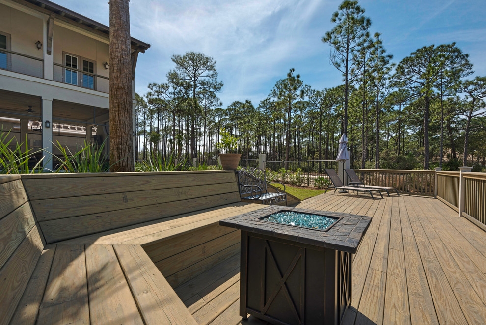 Inspiration for a large beach style backyard deck in Other with with dock and no cover.