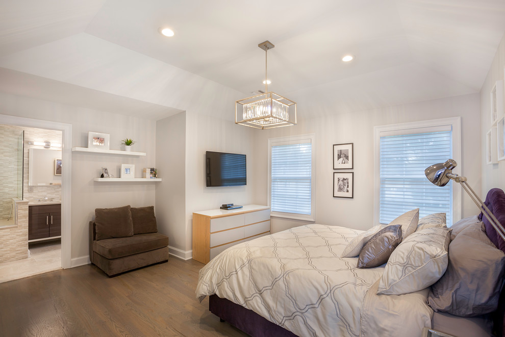 Photo of a large transitional master bedroom in New York with grey walls, no fireplace, dark hardwood floors and brown floor.