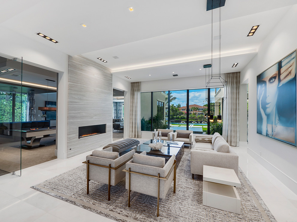 Photo of a mid-sized contemporary formal open concept living room in Miami with white walls, marble floors, a ribbon fireplace and no tv.