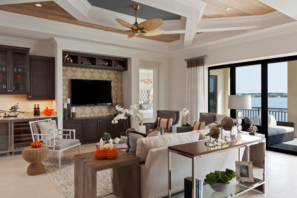Traditional open concept living room in Miami with a home bar, white walls and a wall-mounted tv.