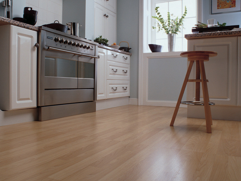 Inspiration for a transitional light wood floor kitchen remodel in Toronto with white cabinets, granite countertops, blue backsplash, stainless steel appliances and an island