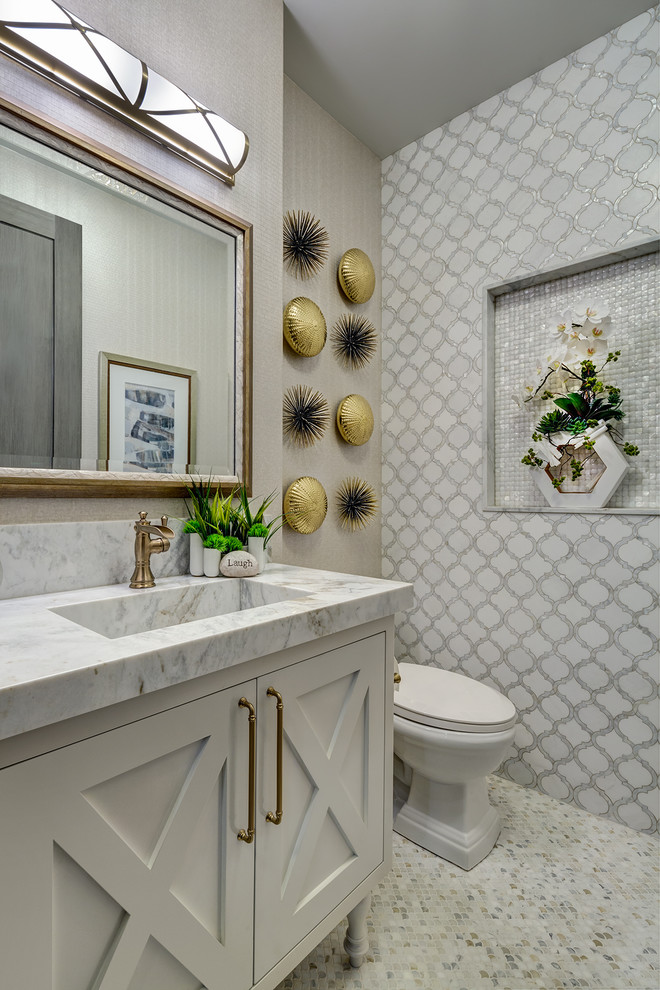 Design ideas for a small beach style powder room in Orange County with furniture-like cabinets, white cabinets, grey walls, mosaic tile floors, an integrated sink, marble benchtops, multi-coloured floor, multi-coloured tile and grey benchtops.