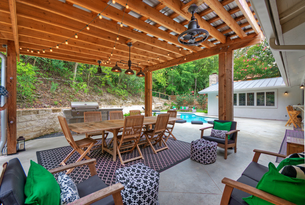 Design ideas for a large transitional full sun backyard concrete paver retaining wall landscape in Austin for spring.