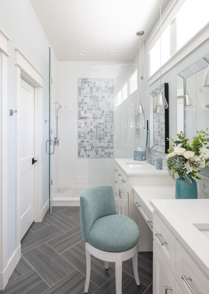 This is an example of a large beach style master bathroom in Dallas with white cabinets, gray tile, multi-coloured tile, white tile, blue walls, an undermount sink, quartzite benchtops, a hinged shower door, white benchtops, recessed-panel cabinets, an alcove shower and grey floor.