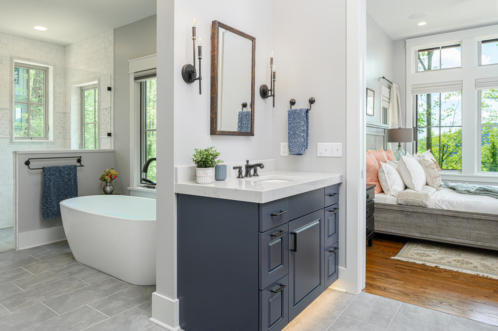 Design ideas for a large arts and crafts master bathroom in Other with blue cabinets.