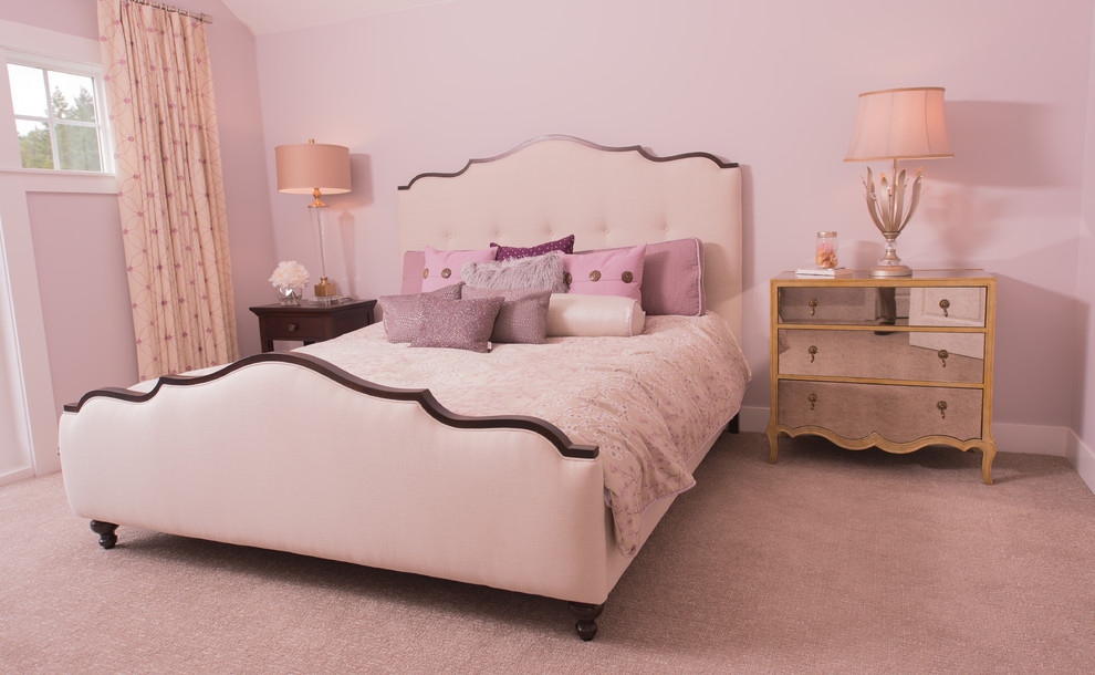 Photo of a mid-sized transitional master bedroom in Portland with pink walls, carpet, no fireplace and beige floor.