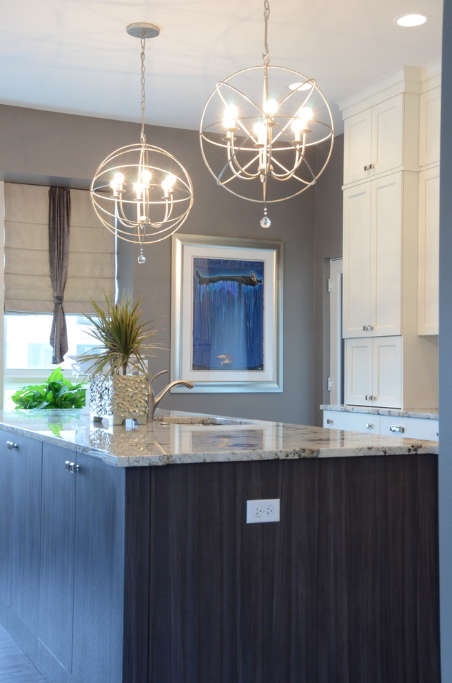 Open concept kitchen - mid-sized transitional l-shaped dark wood floor open concept kitchen idea in Chicago with an undermount sink, flat-panel cabinets, gray cabinets, granite countertops, gray backsplash, subway tile backsplash, stainless steel appliances, gray walls and an island