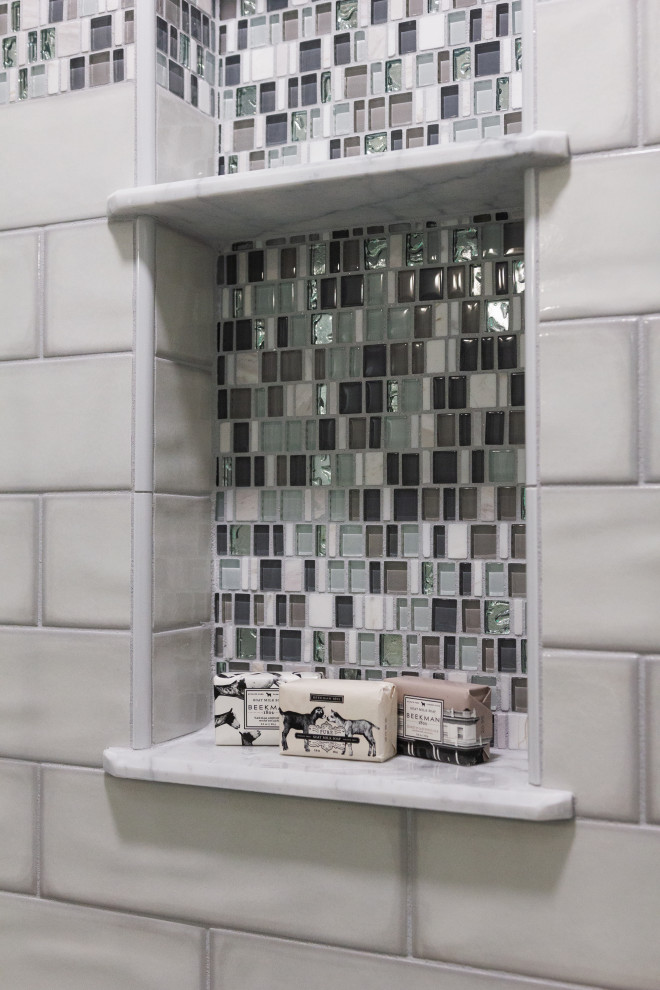 Sliding shower door - mid-sized transitional master green tile and ceramic tile porcelain tile, white floor and double-sink sliding shower door idea with shaker cabinets, gray cabinets, a two-piece toilet, an undermount sink, quartz countertops, white countertops, a niche and a built-in vanity