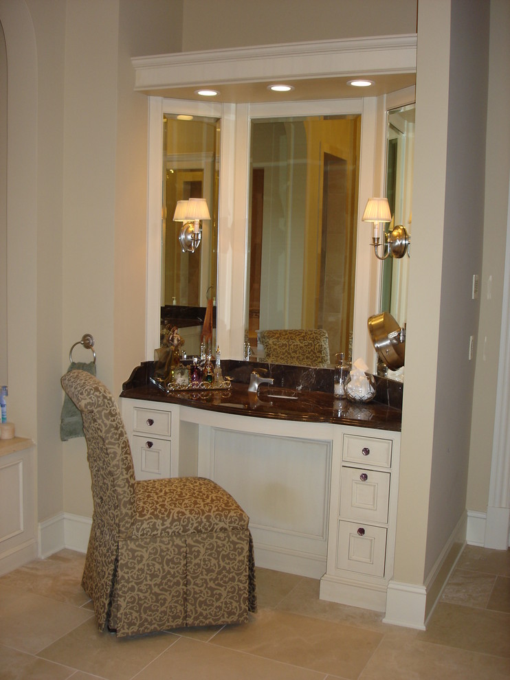 Inspiration for a large transitional master bathroom in Chicago with a wall-mount sink, glass-front cabinets, white cabinets, marble benchtops, beige tile, stone tile, beige walls and travertine floors.