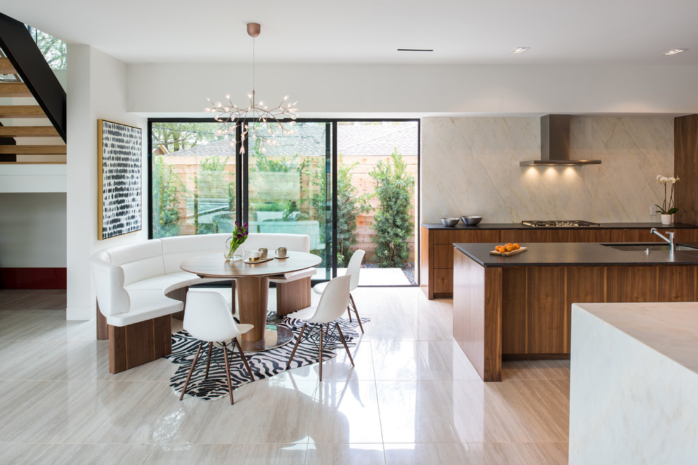 This is an example of a contemporary open plan dining in Houston with white walls and beige floor.