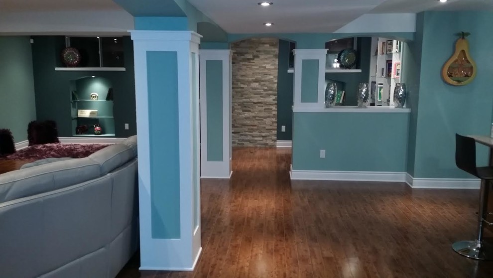 Design ideas for a mid-sized contemporary basement in Ottawa with blue walls, medium hardwood floors and no fireplace.
