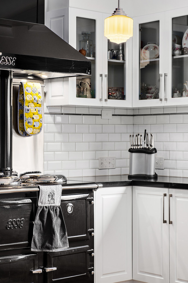 Design ideas for a modern kitchen in Perth with solid surface benchtops and no island.