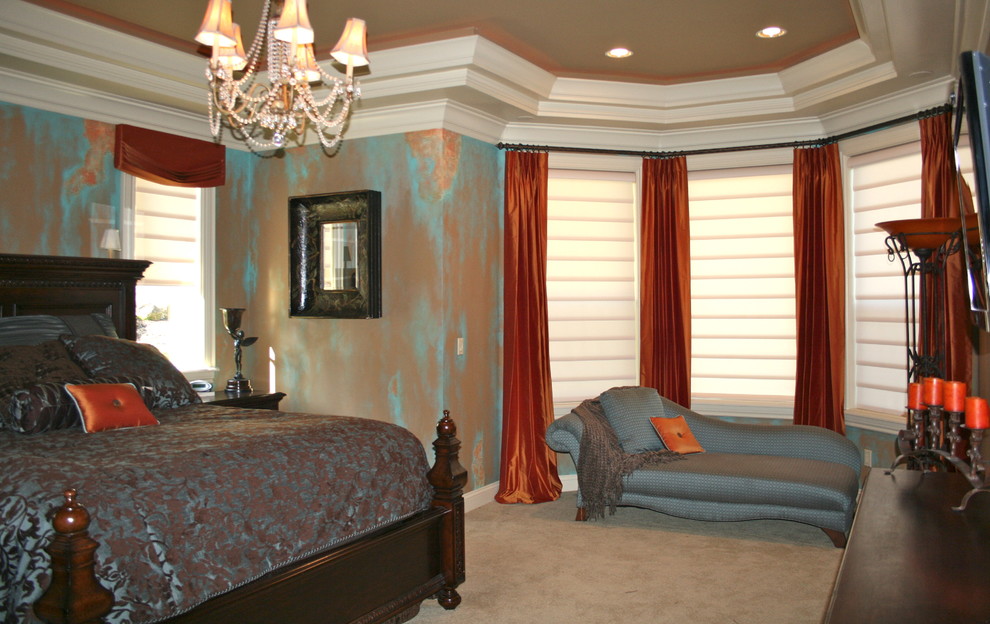 This is an example of a large traditional master bedroom in Portland with multi-coloured walls, carpet and beige floor.