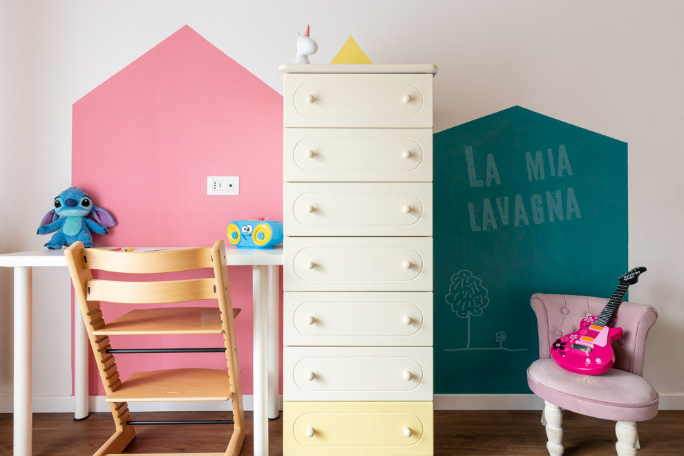 Photo of a mid-sized contemporary kids' room for girls in Other with multi-coloured walls and porcelain floors.