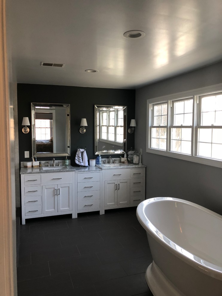 Photo of a Mid-sized modern Master bathroom in DC Metro With Shaker Cabinets, White Cabinets, a Corner Shower, Beige Tile, Grey Walls, Slate Floors, an Undermount Sink, Granite Benchtops and Gray.