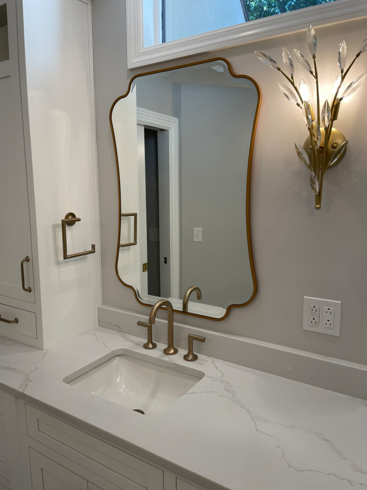 This is an example of a large transitional master wet room bathroom in Other with flat-panel cabinets, white cabinets, a freestanding tub, a two-piece toilet, multi-coloured tile, porcelain tile, white walls, an undermount sink, engineered quartz benchtops, multi-coloured floor, a hinged shower door, white benchtops, an enclosed toilet, a double vanity and a built-in vanity.
