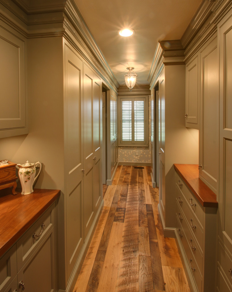 Traditional walk-in wardrobe in Columbus with grey cabinets.