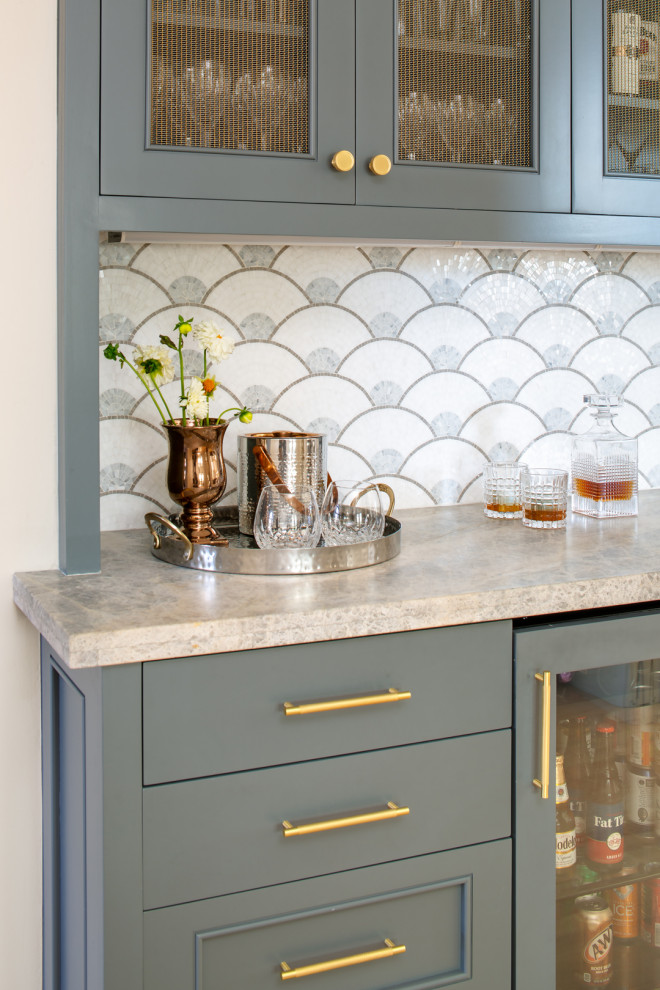 Inspiration for a mid-sized transitional single-wall home bar in San Diego with beaded inset cabinets, blue cabinets, quartzite benchtops, multi-coloured splashback, mosaic tile splashback, light hardwood floors, brown floor and blue benchtop.
