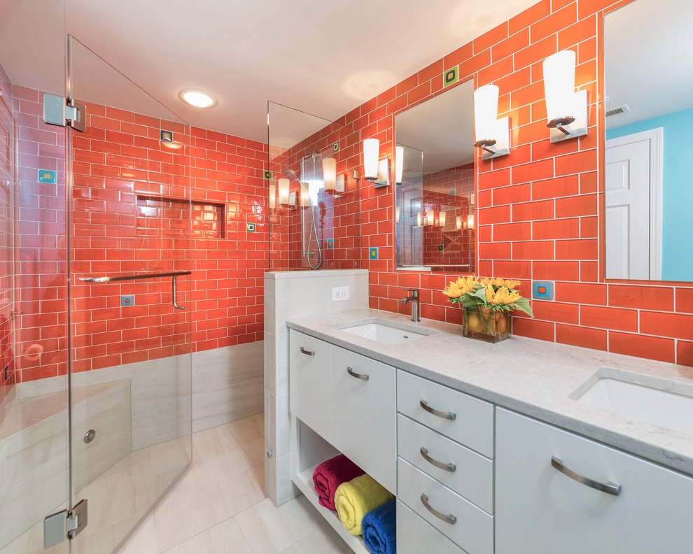 Photo of a mid-sized transitional kids bathroom in Other with flat-panel cabinets, white cabinets, orange tile, porcelain floors, an undermount sink, engineered quartz benchtops, beige floor, a hinged shower door, a curbless shower and subway tile.