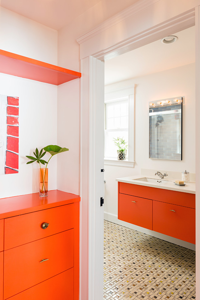 Photo of a contemporary bathroom in Boston with orange cabinets, multi-coloured tile, ceramic tile, white walls, ceramic floors, an undermount sink and flat-panel cabinets.