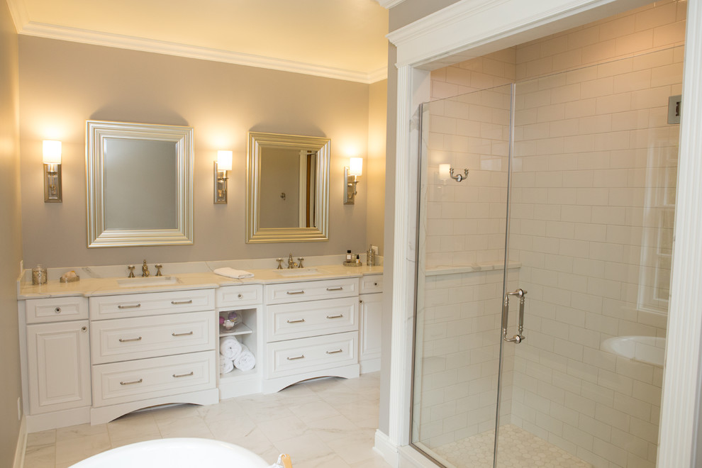 Design ideas for a large traditional master bathroom in Chicago with raised-panel cabinets, white cabinets, a claw-foot tub, an alcove shower, a bidet, white tile, porcelain tile, grey walls, porcelain floors, an undermount sink and engineered quartz benchtops.