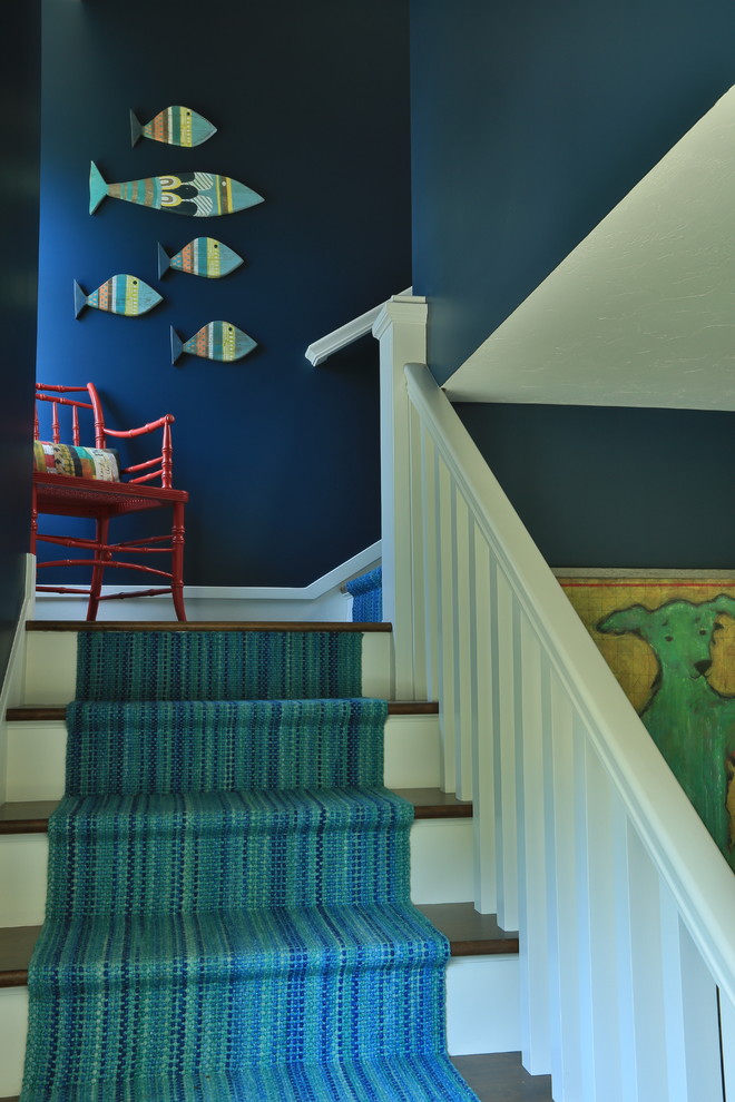 Inspiration for a small beach style wood l-shaped staircase in Grand Rapids with painted wood risers.
