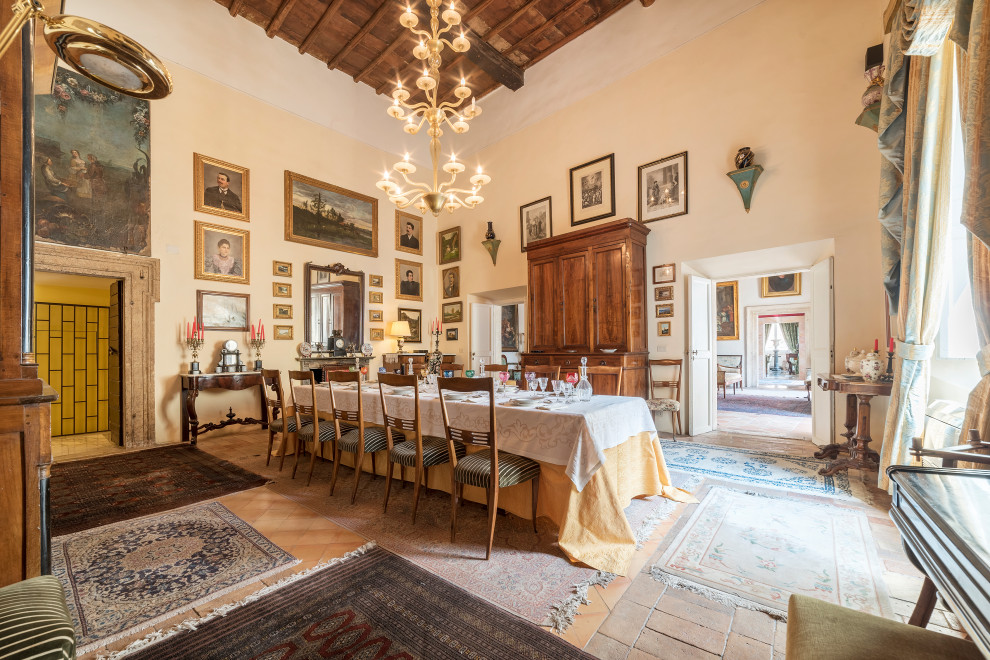 Inspiration for a traditional dining room in Rome with beige walls and multi-coloured floor.
