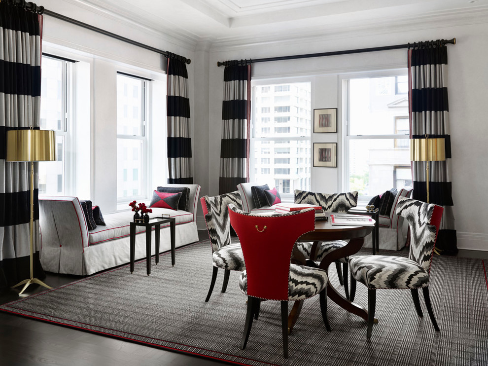 Large trendy dark wood floor, brown floor and tray ceiling enclosed dining room photo in Chicago with white walls, a standard fireplace and a wood fireplace surround