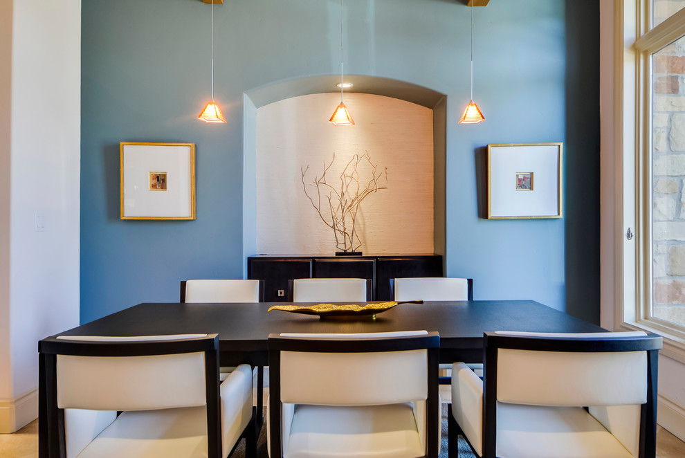 Inspiration for a mid-sized transitional separate dining room in Austin with blue walls and travertine floors.