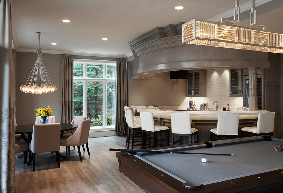 This is an example of an expansive transitional home bar in Detroit.