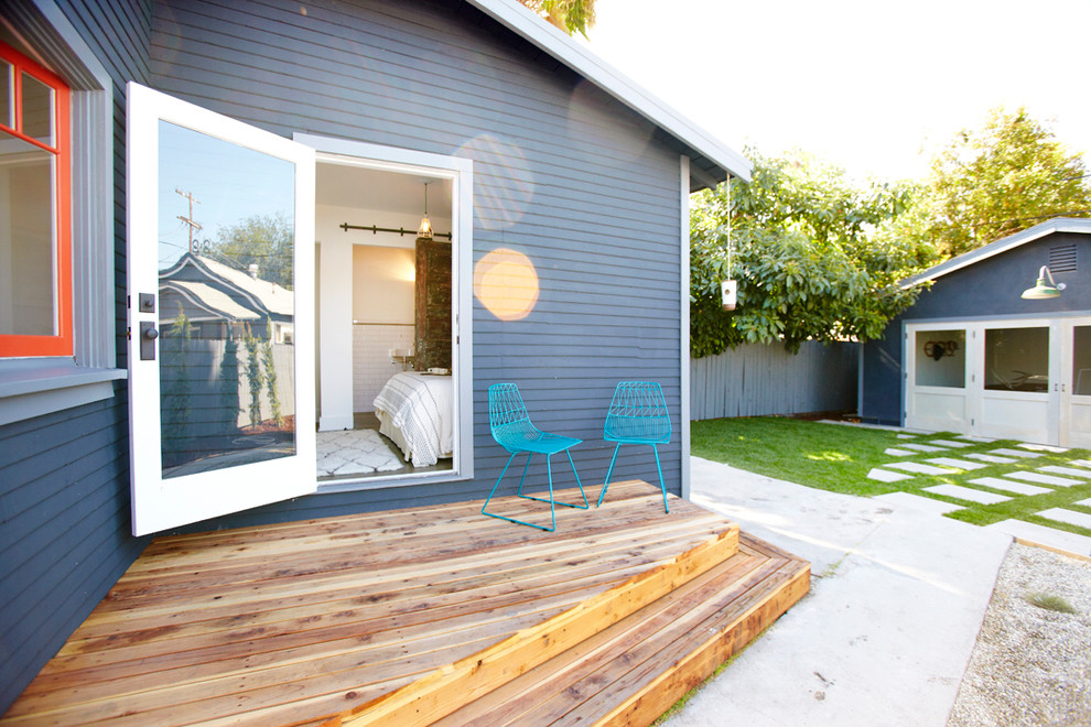 Deck - eclectic backyard deck idea in Los Angeles with decking and no cover