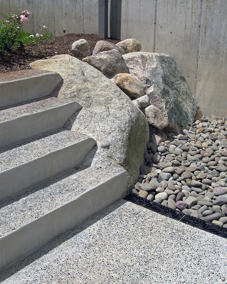 Inspiration for a mid-sized contemporary full sun formal garden in Boston with a garden path and natural stone pavers.
