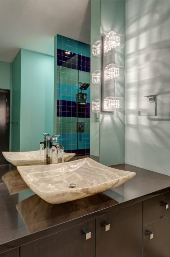 Example of a mid-sized transitional 3/4 blue tile and ceramic tile alcove shower design in St Louis with flat-panel cabinets, dark wood cabinets, gray walls, a vessel sink, quartz countertops and brown countertops