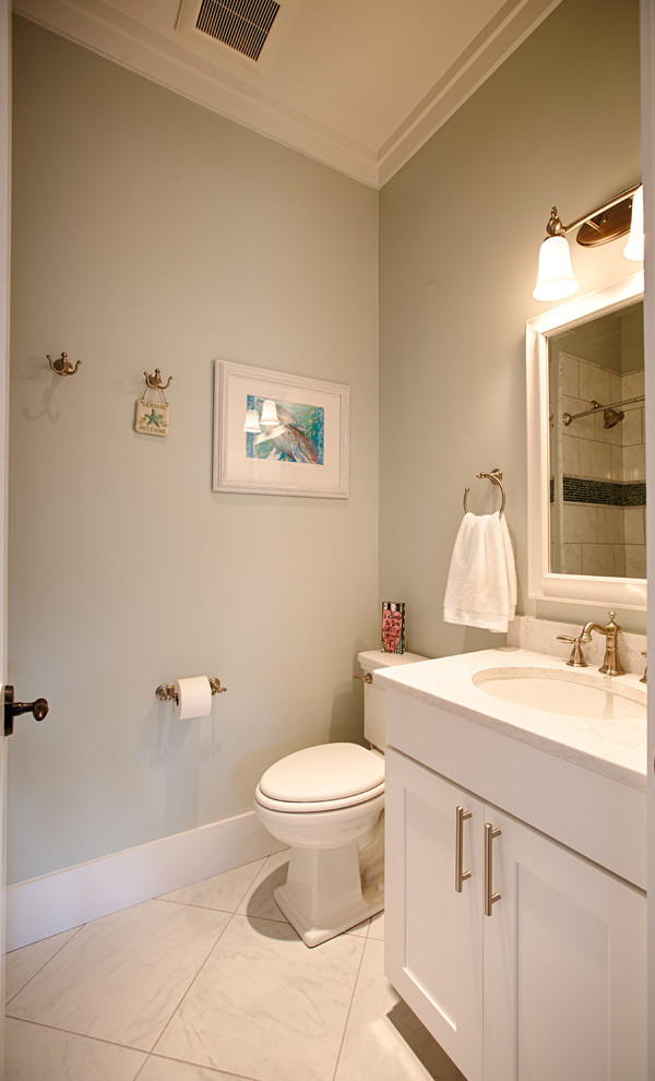 Design ideas for a mid-sized beach style kids bathroom in Miami with shaker cabinets, white cabinets, a shower/bathtub combo, an undermount sink, engineered quartz benchtops, a freestanding tub, a two-piece toilet, brown tile, travertine, grey walls, travertine floors, beige floor and a shower curtain.