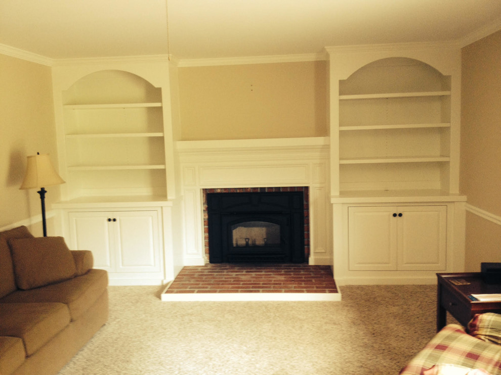 Photo of a contemporary family room in Baltimore with carpet and a brick fireplace surround.